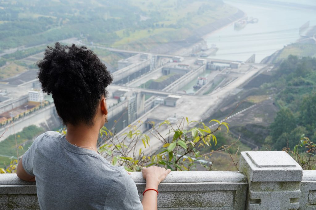 looking over woman's shoulder at the ship locks of the Three Gorges Dam