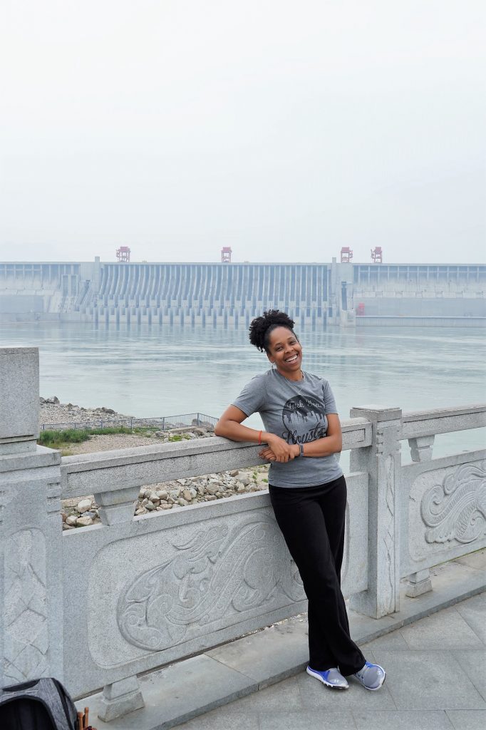 woman standing in front of Three Gorges Dam spillway