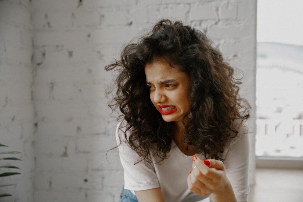 Woman making disgusted face